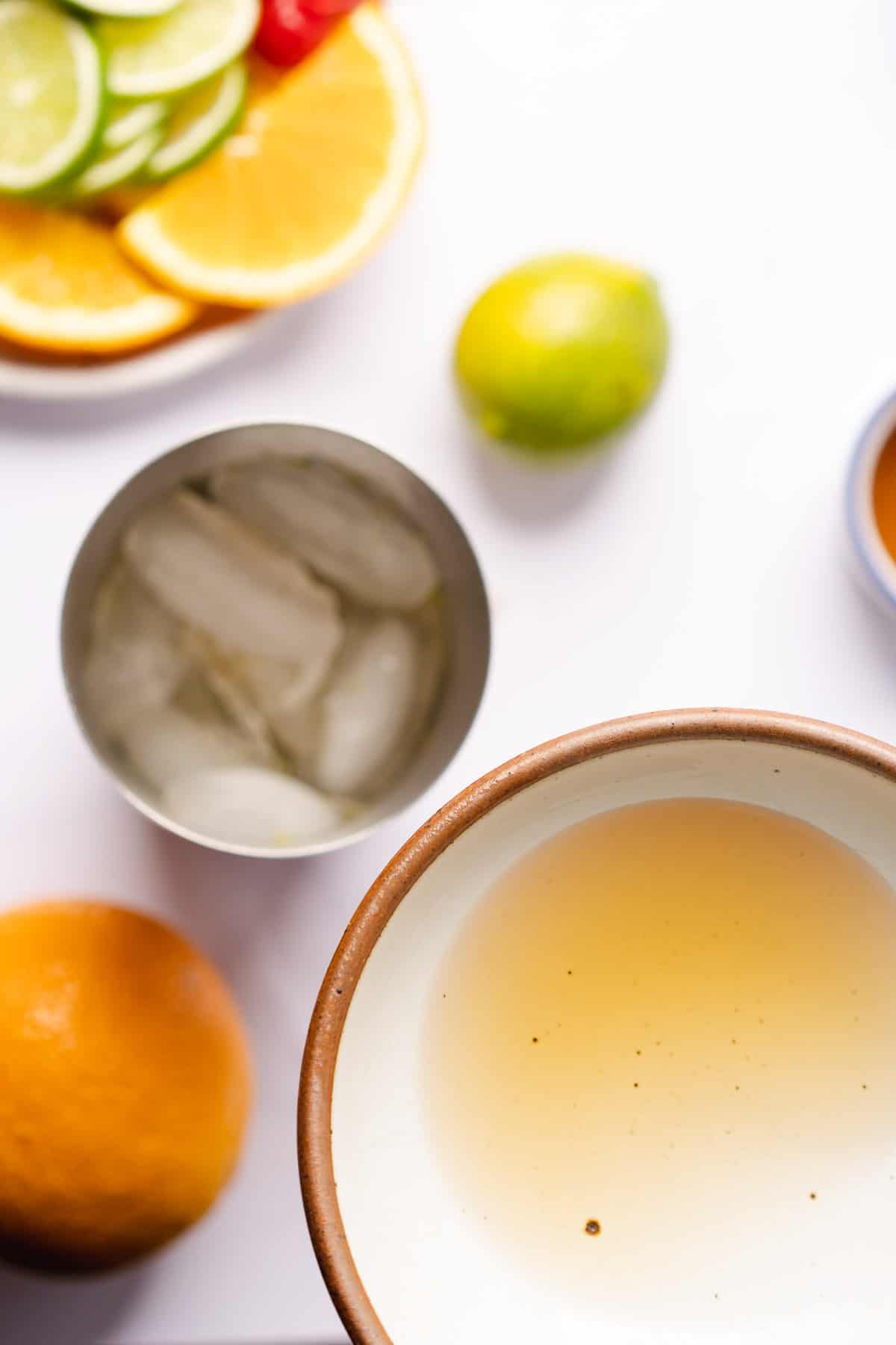 dark rum being added to an ice filled cocktail shaker