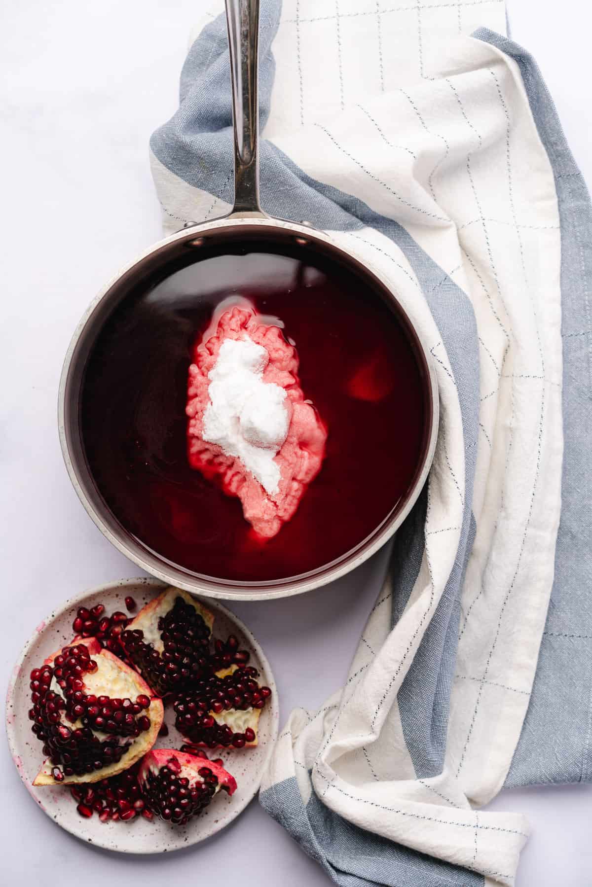 pomegranate juice in a saucepan with allulose sweetener