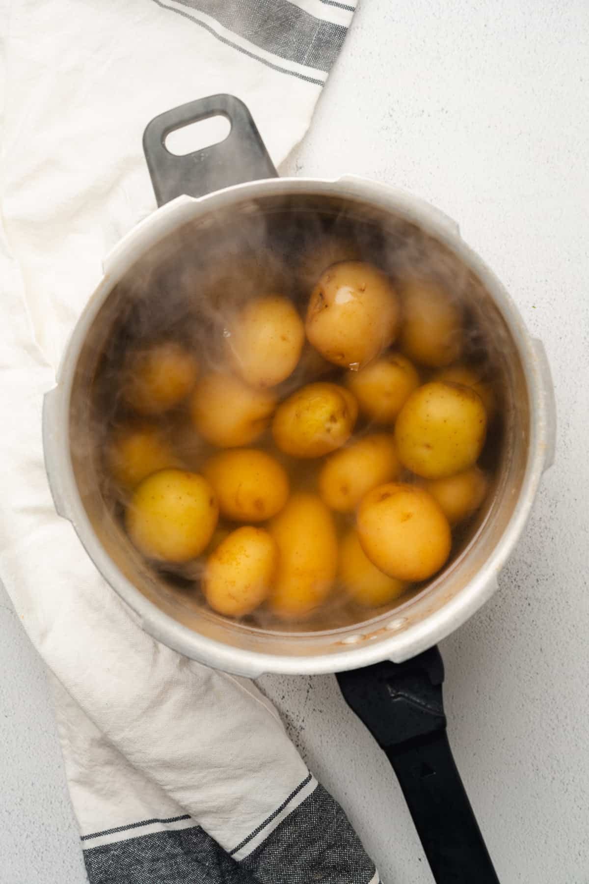 boiling potatoes in a pot of hot salted water 