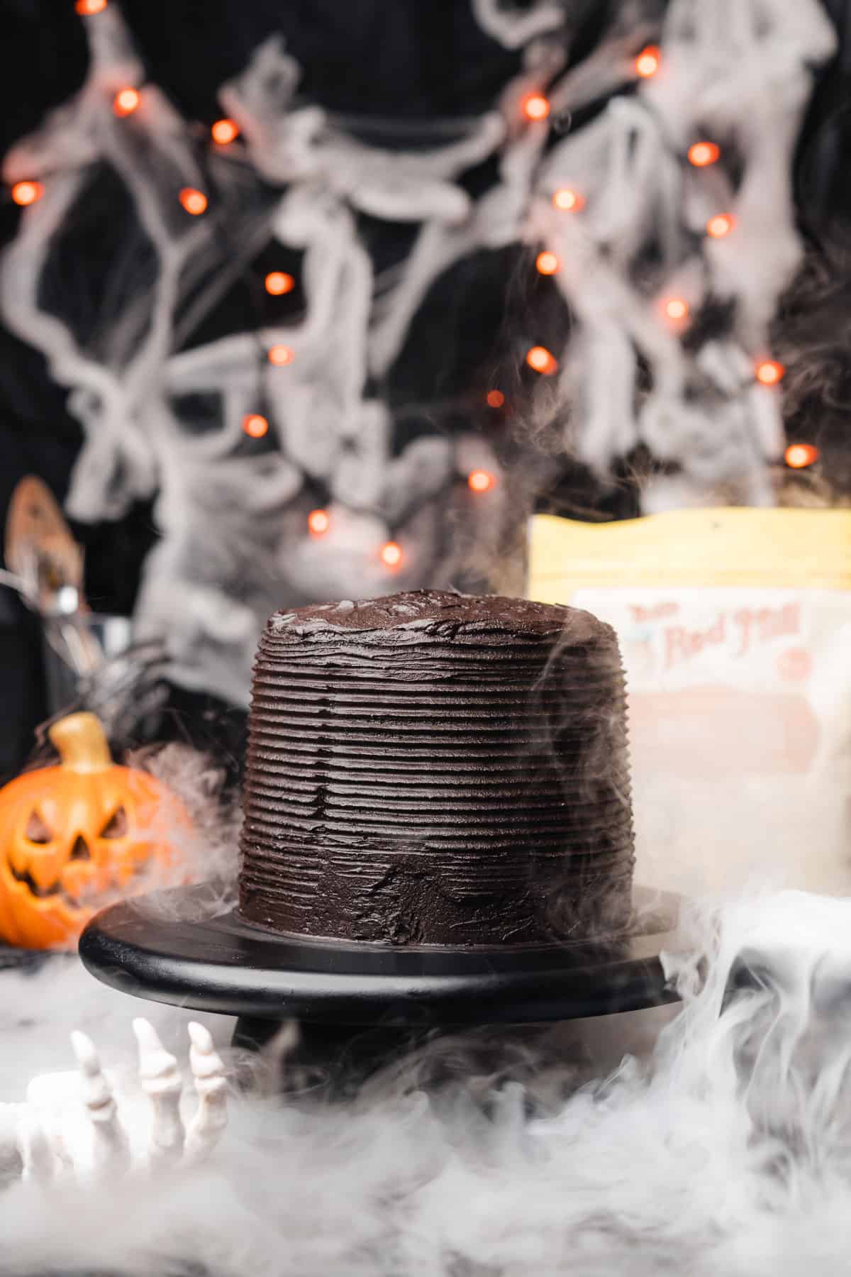 bob's red mill layered black velvet cake for halloween with dry ice fog and Halloween decor