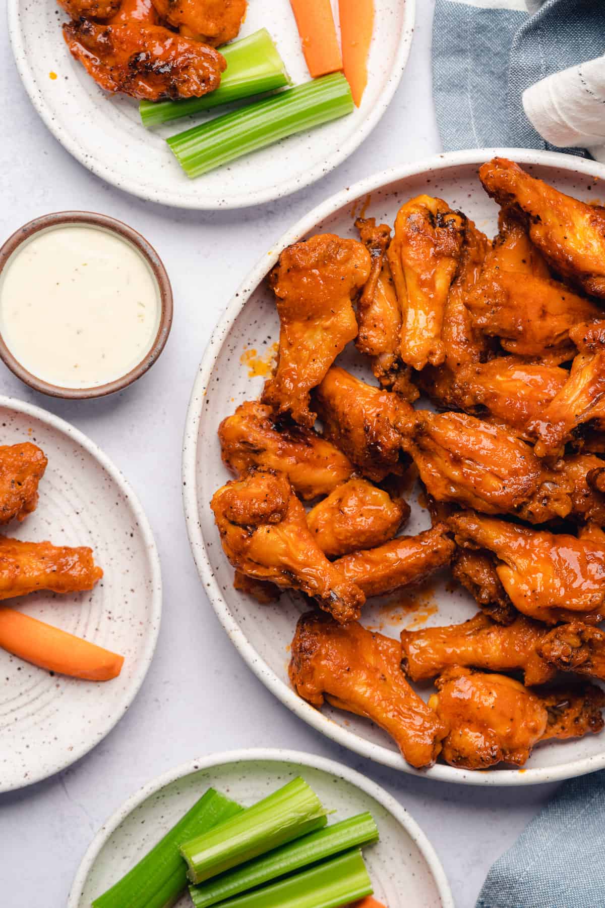 crispy baked chicken wings with buffalo sauce, ranch and veggies