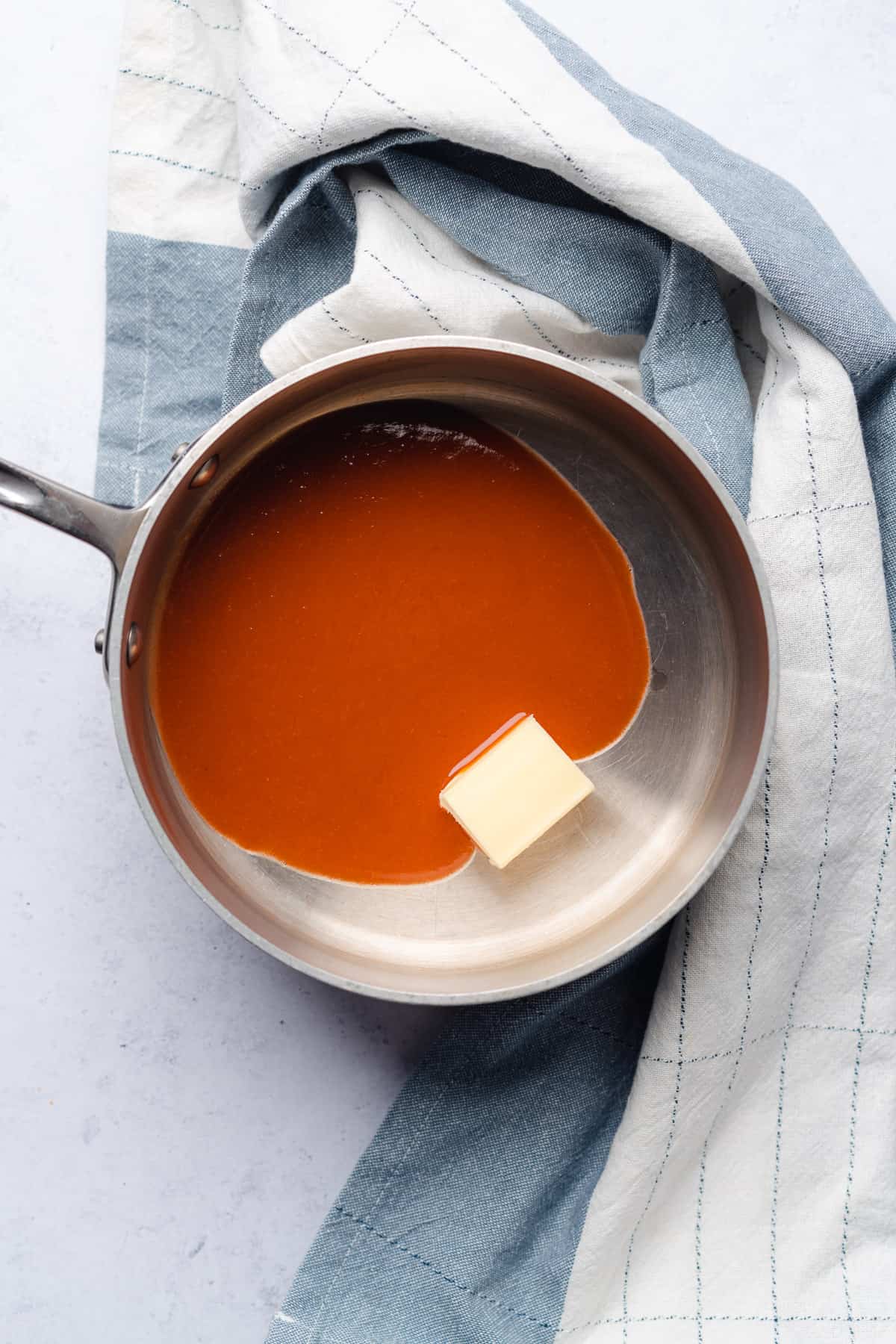 hot sauce with butter in a saucepan