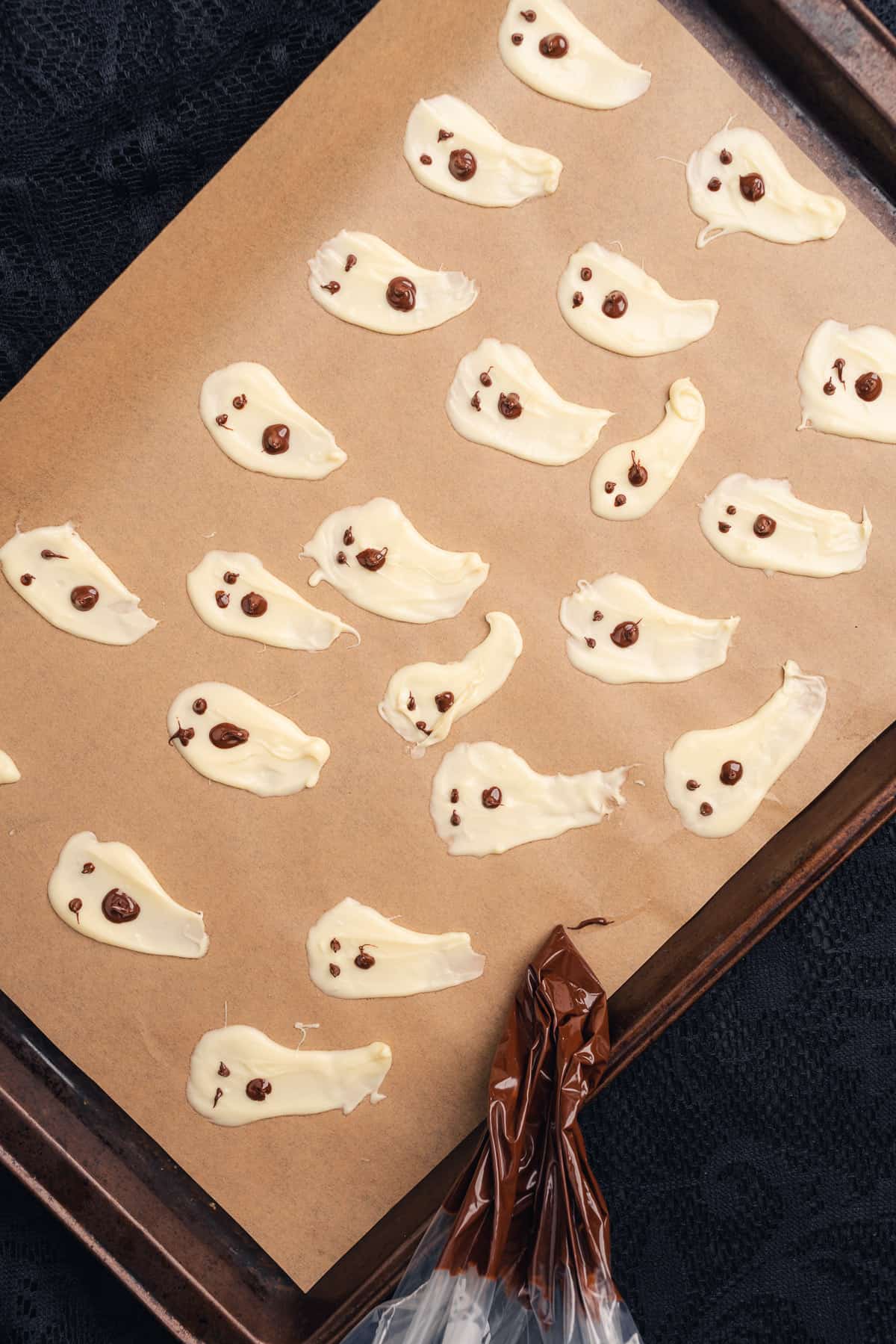 chocolate ghosts on parchment paper