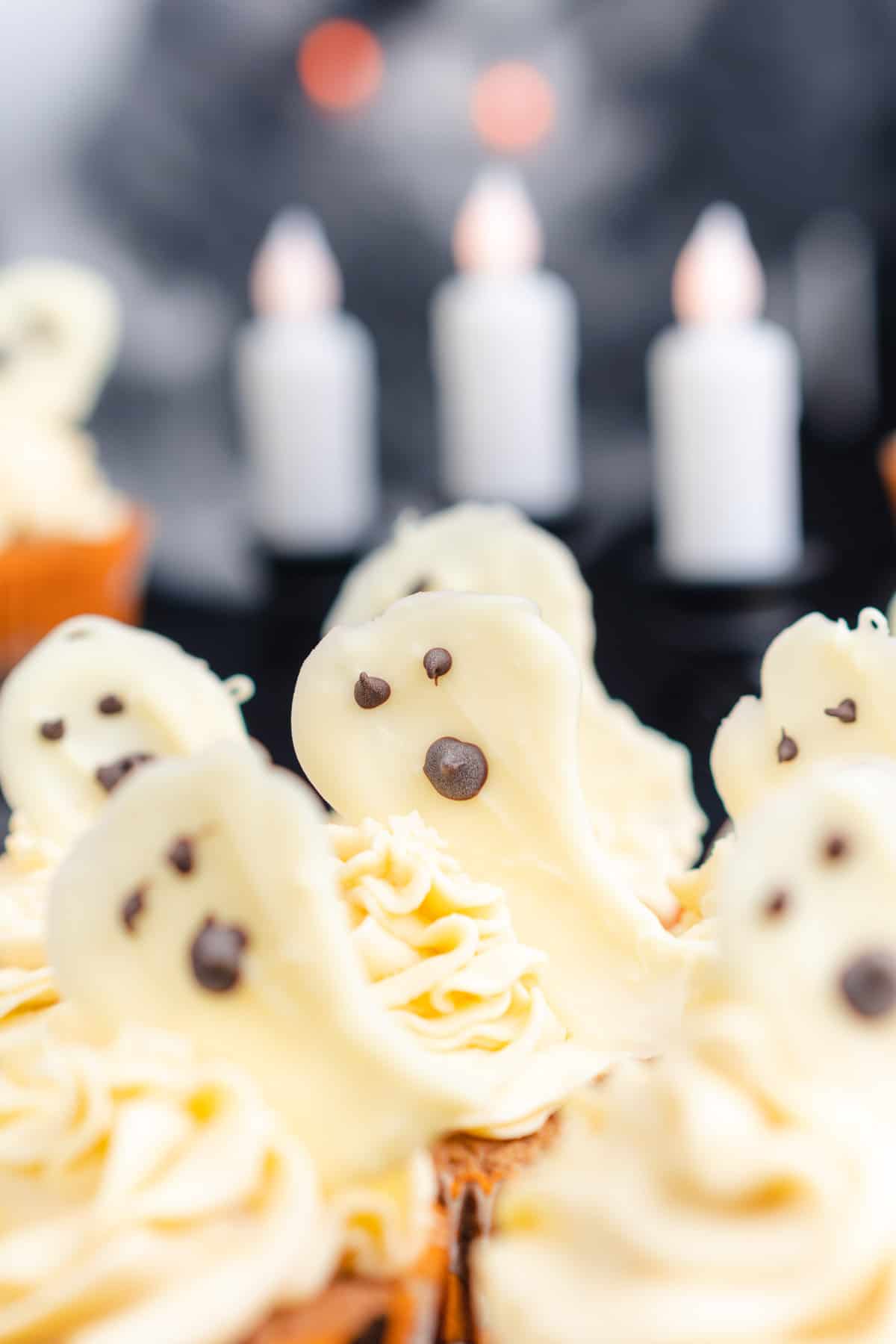 keto ghost cupcakes with candles and dry ice in the background