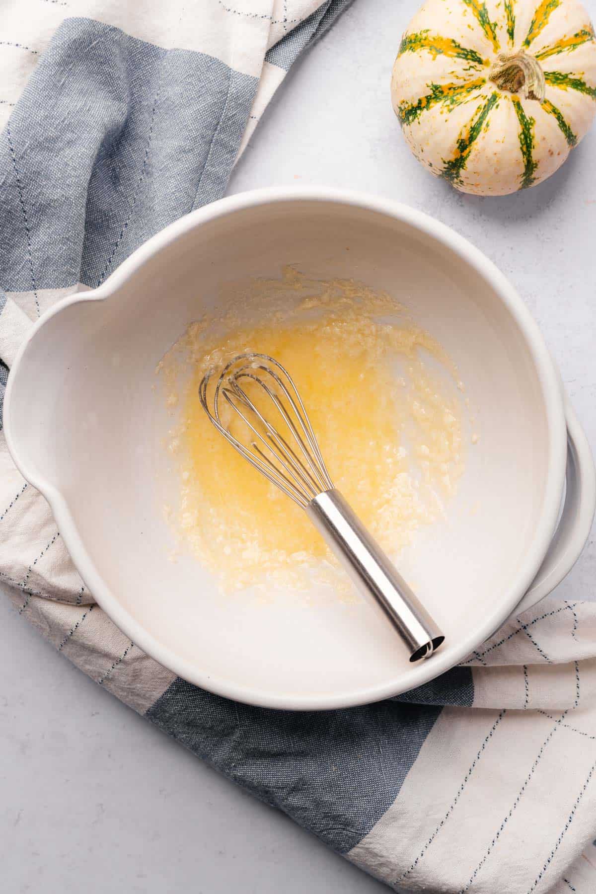 whisked butter and sweetener in a ceramic mixing bowl