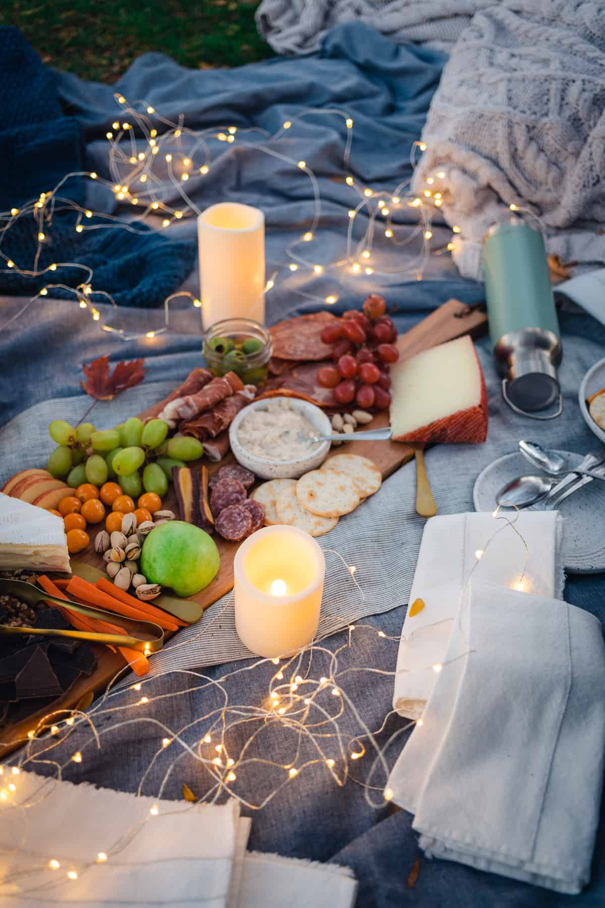 stunning whimsical fall picnic with a charcuterie board and mulled wine