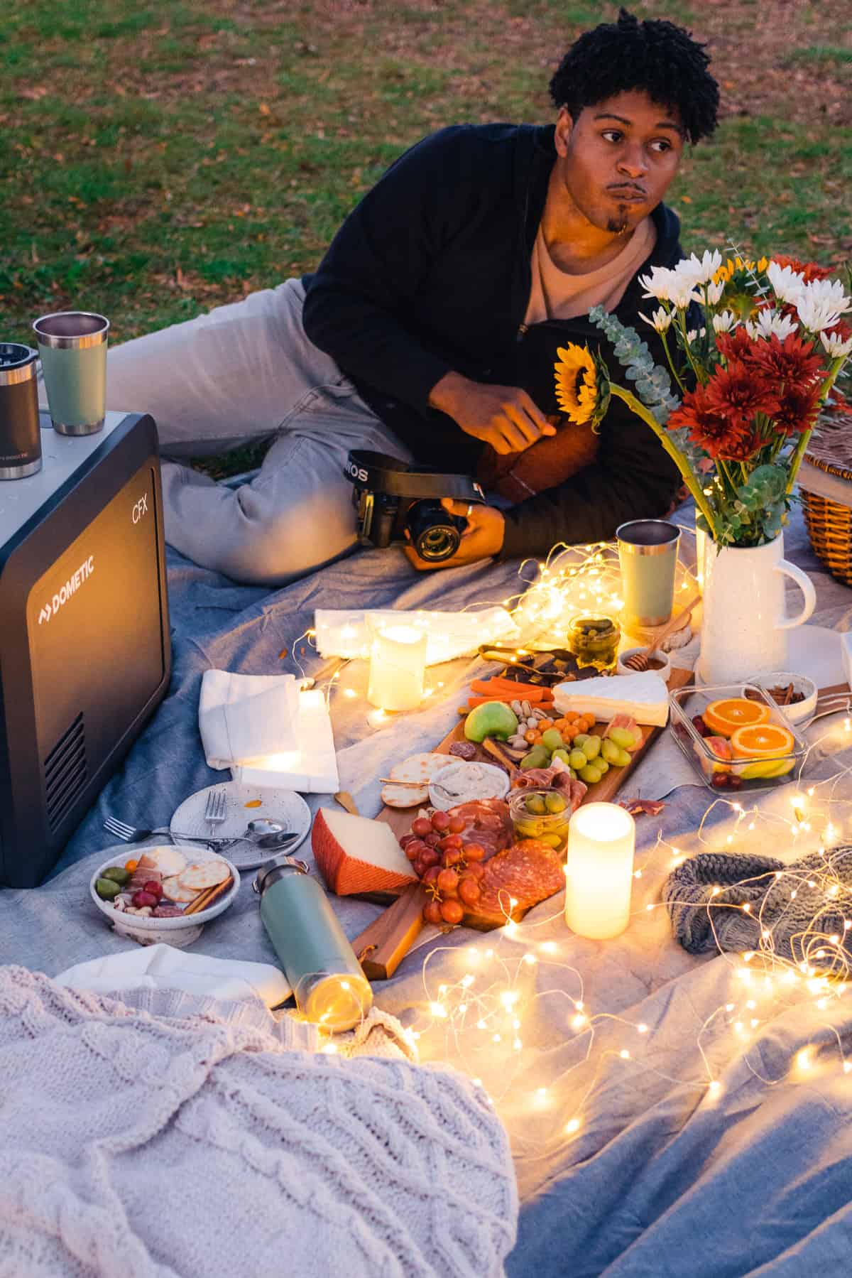 super cozy fall picnic with ambient lighting, flowers and cozy blankets 