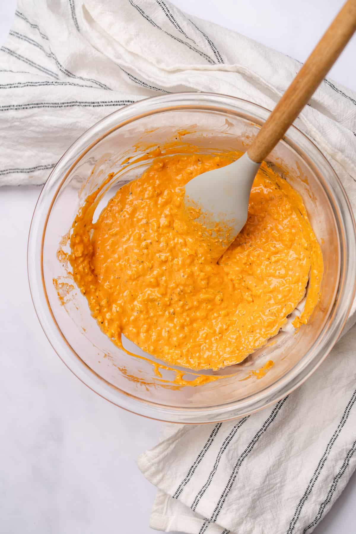 buffalo cheese sauce mixed in a glass bowl