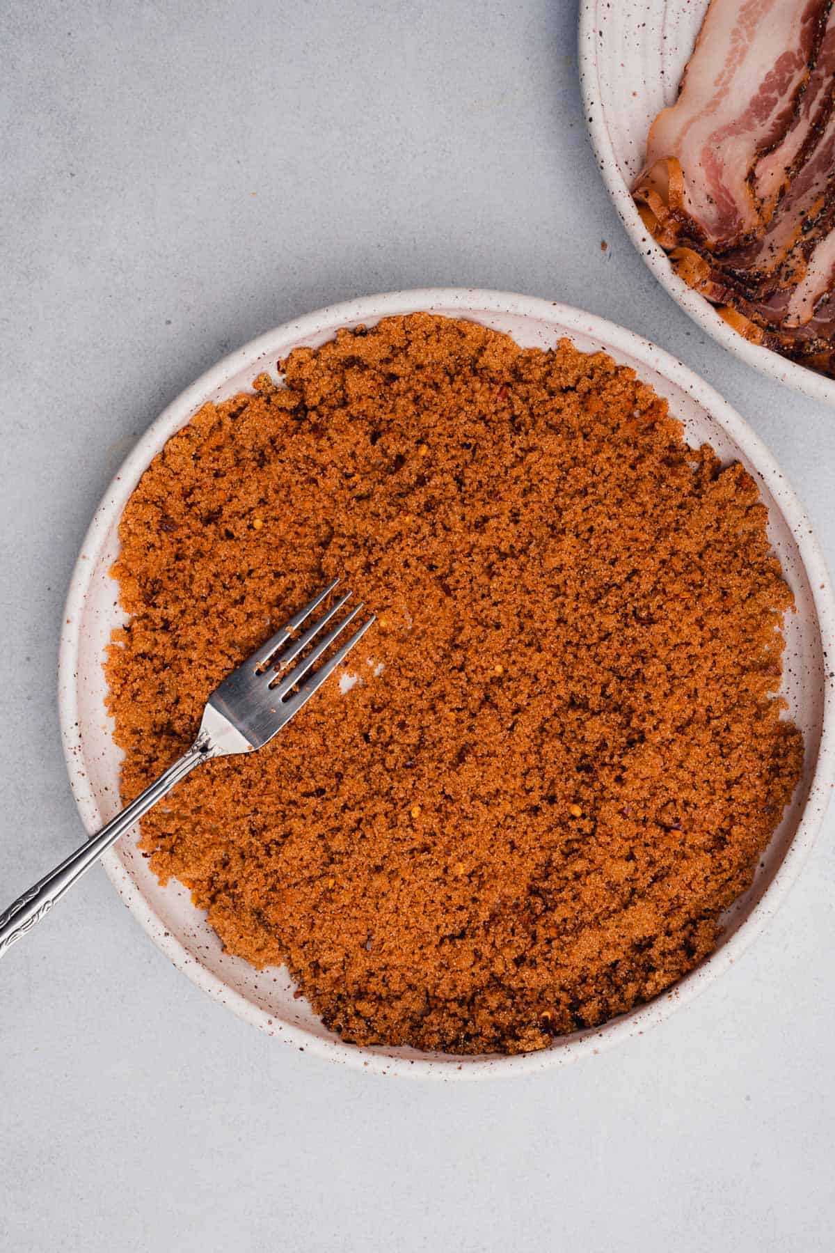 large shallow plate with seasoned brown sugar 