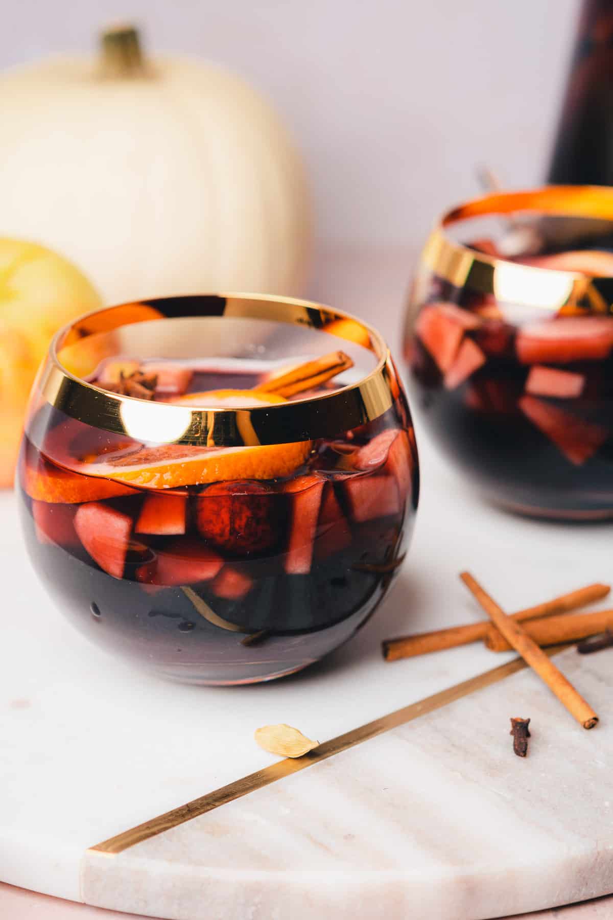 close up shot of bourbon whiskey sangria in goblet style glasses