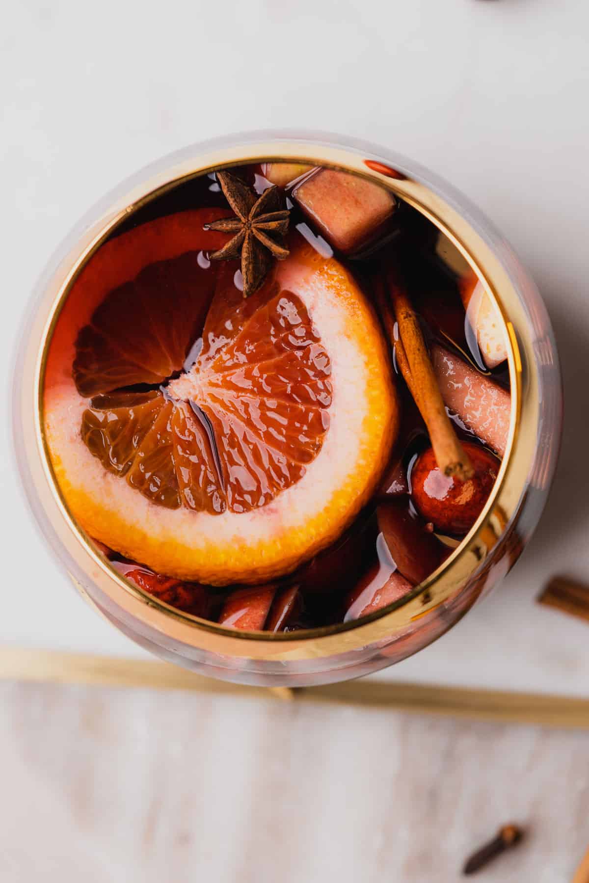 flat lay shot of bourbon whiskey sangria with fresh fruit on top