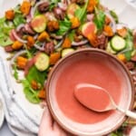 cranberry salad dressing over top of a lovely harvest salad for fall