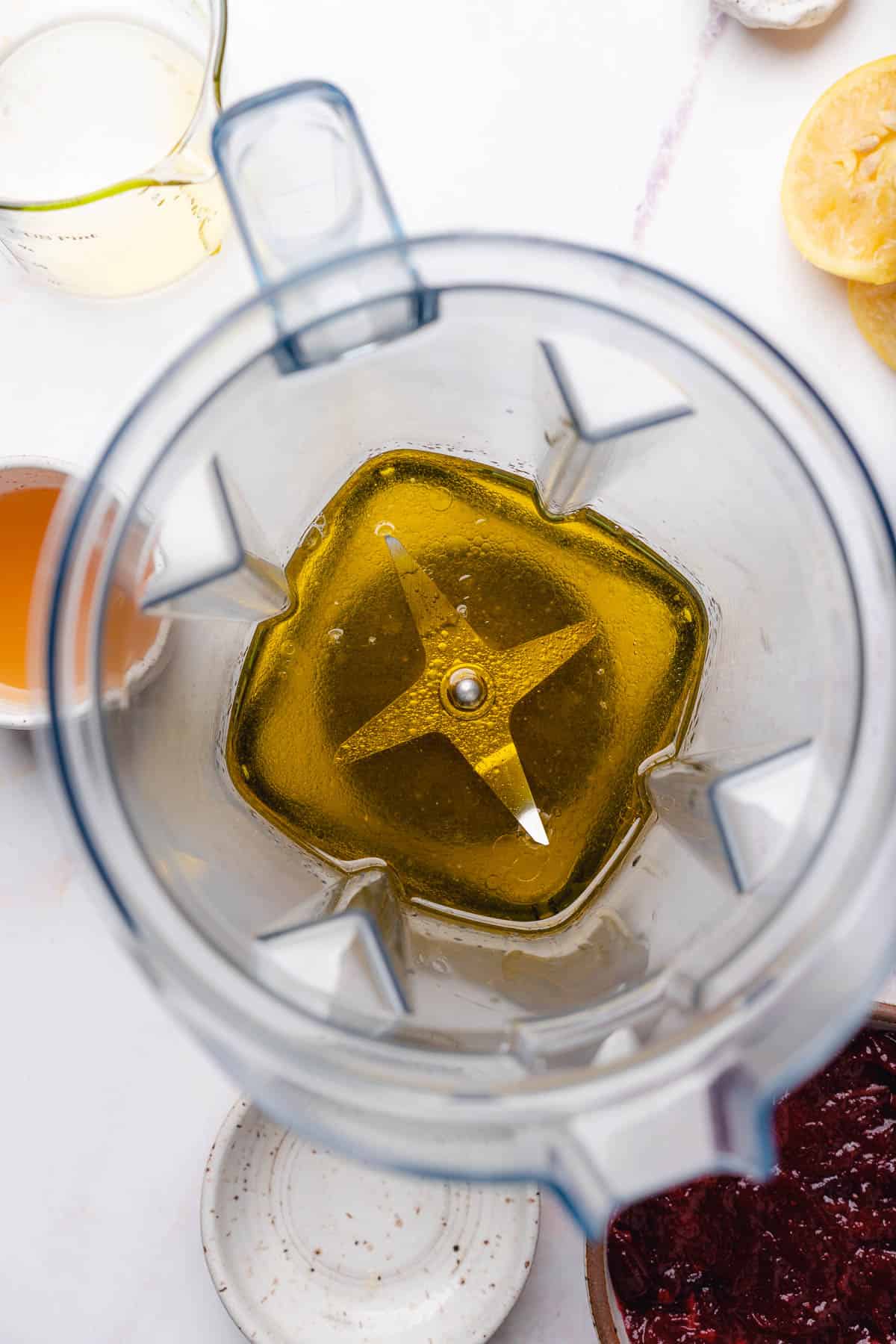 olive oil and lemon juice in a blender 