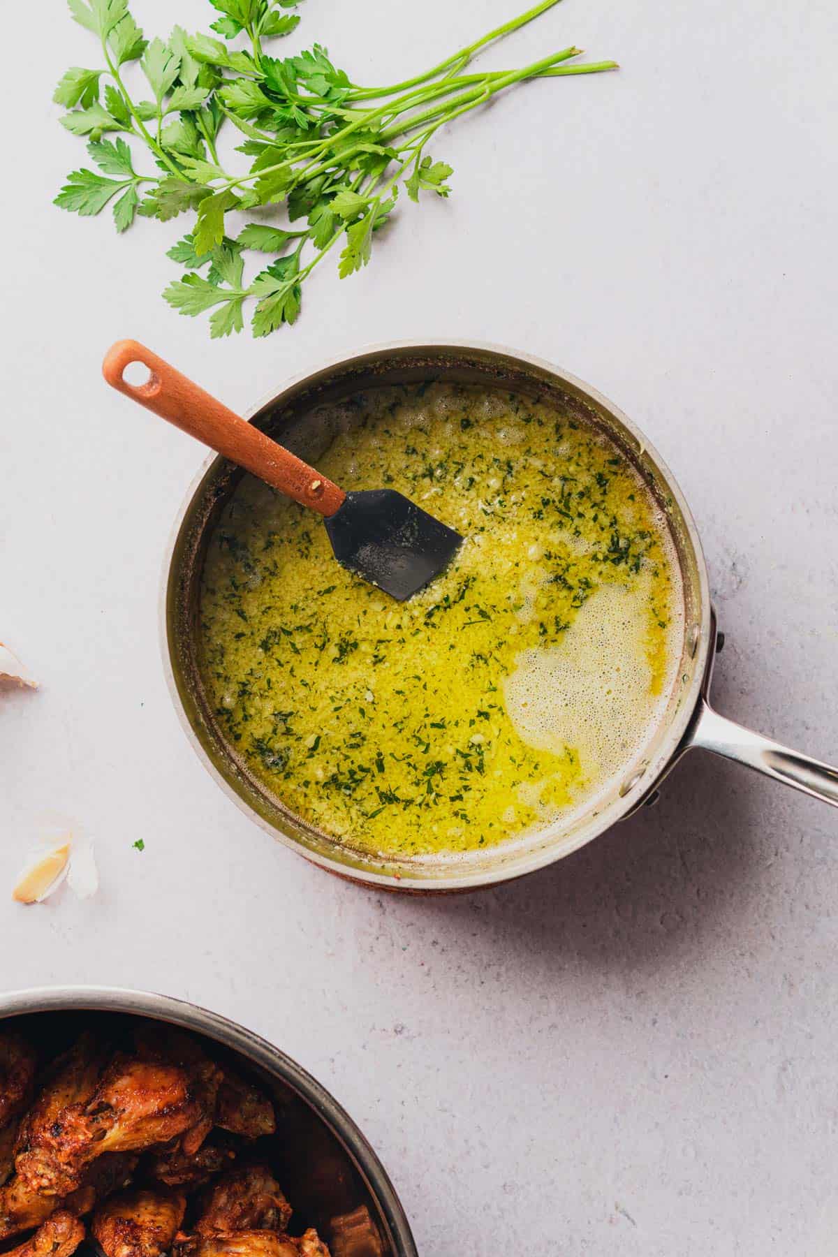 buttery garlic parmesan sauce with parsley in a small saucepan