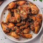 air fryer garlic parmesan wings on a white plate