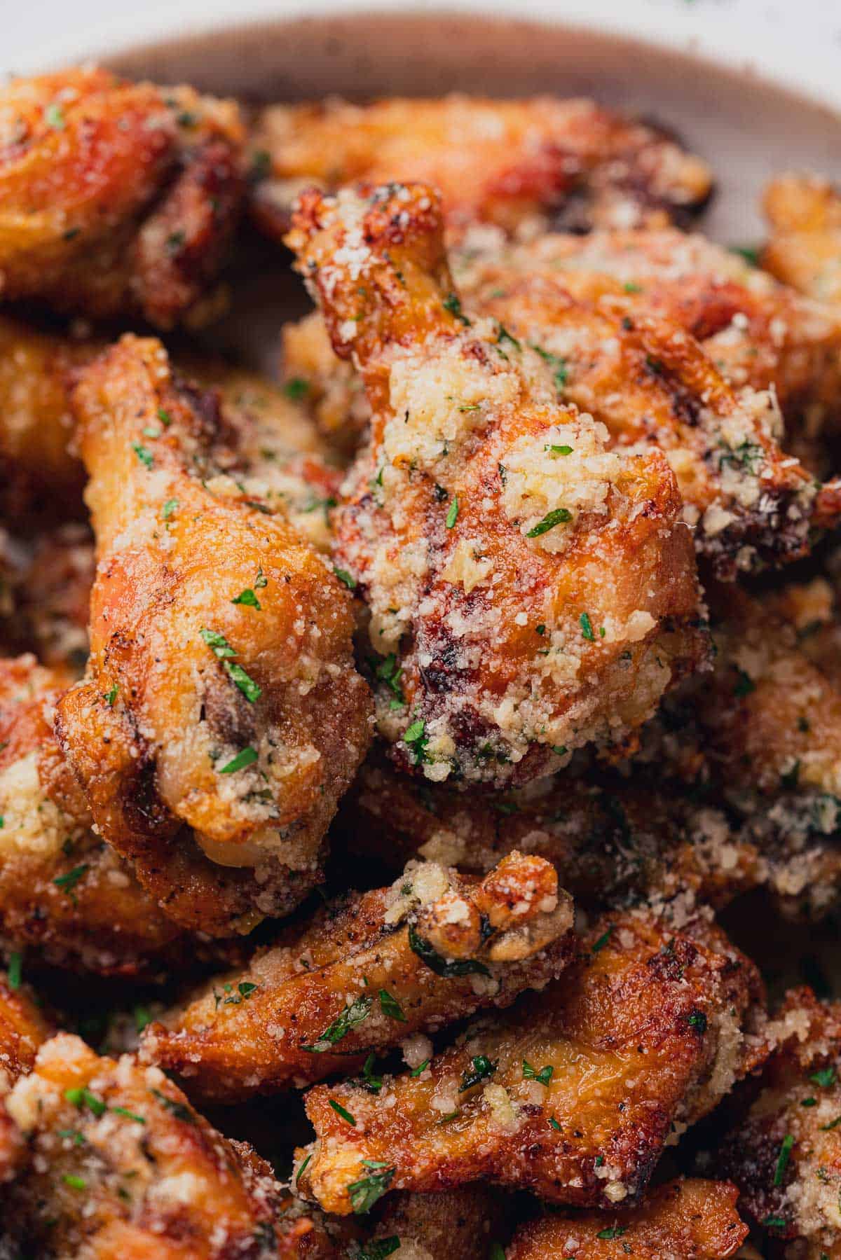 close up shot of garlic parmesan chicken wings made in the air fryer 