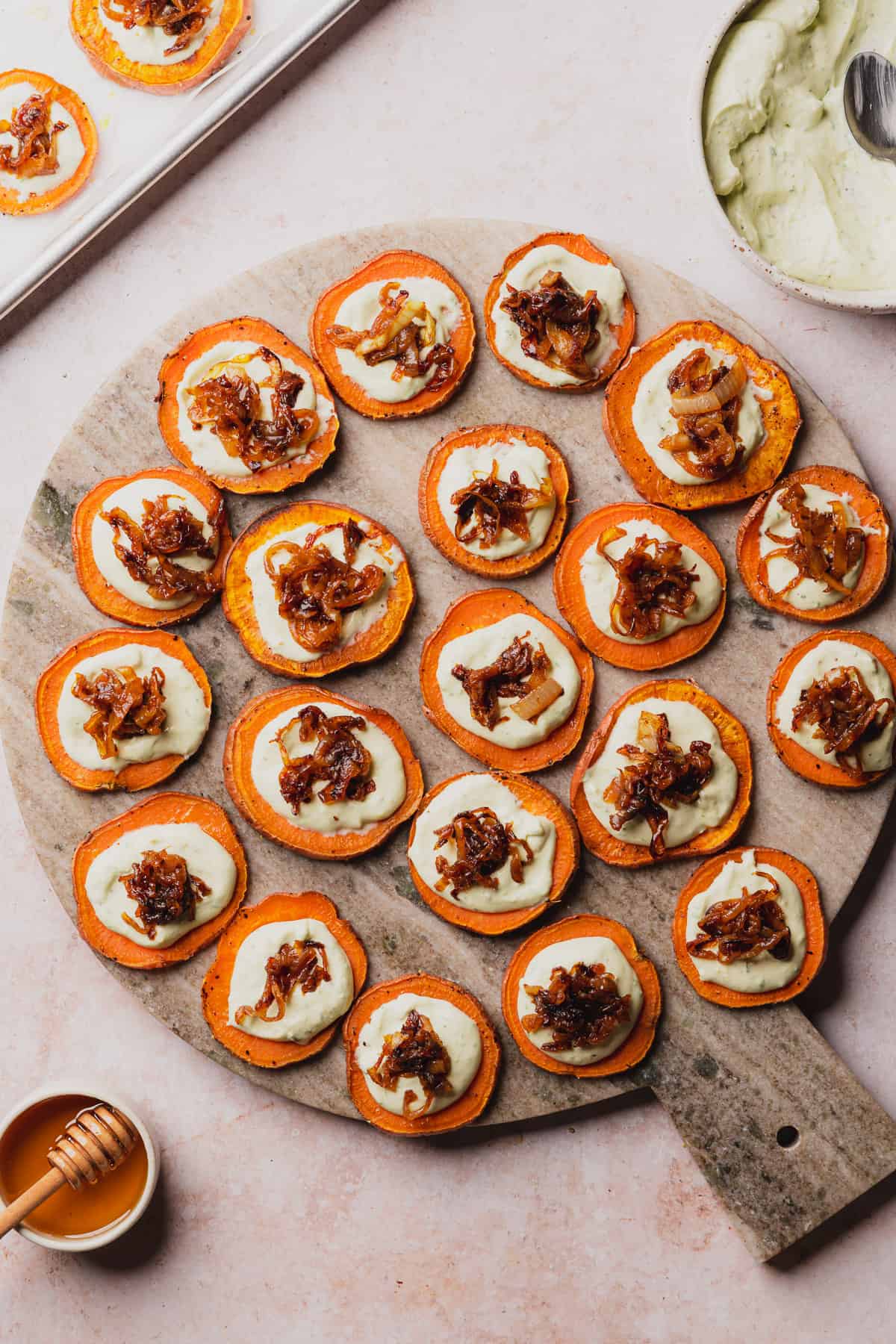 sweet potato rounds with cheese sauce, and caramelized onions