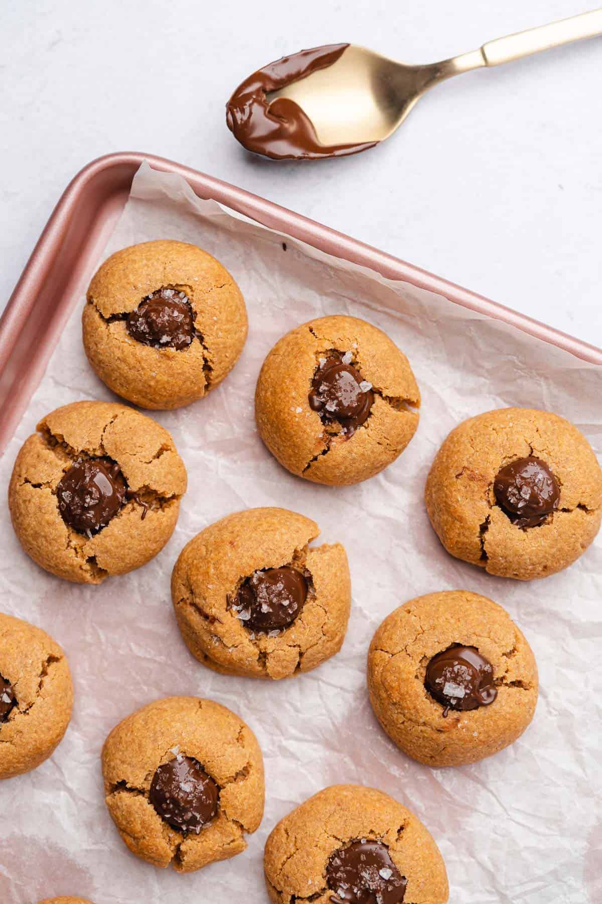 peanut butter blossom cookies on a baking sheet 