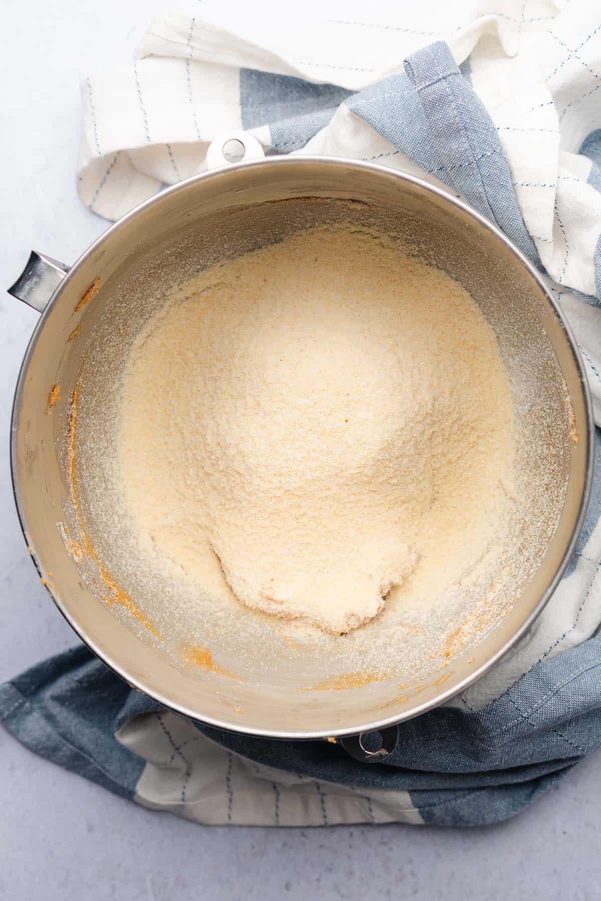 almond flour and coconut flour on top of peanut butter dough