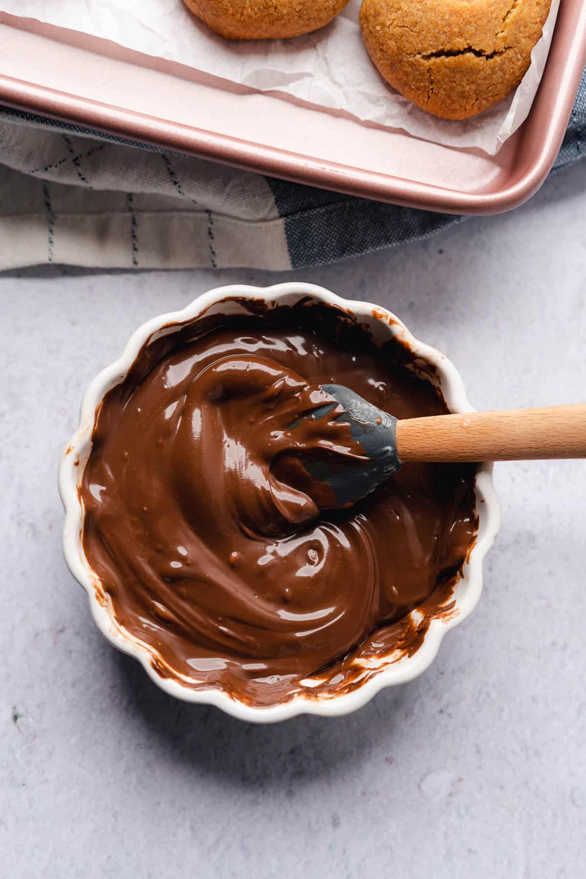 melted chocolate being stirred with a rubber spatula