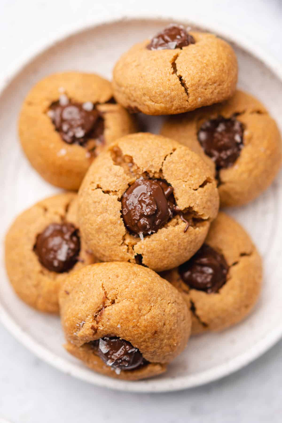 gluten free peanut butter blossoms with a melty chocolate center and sea salt 