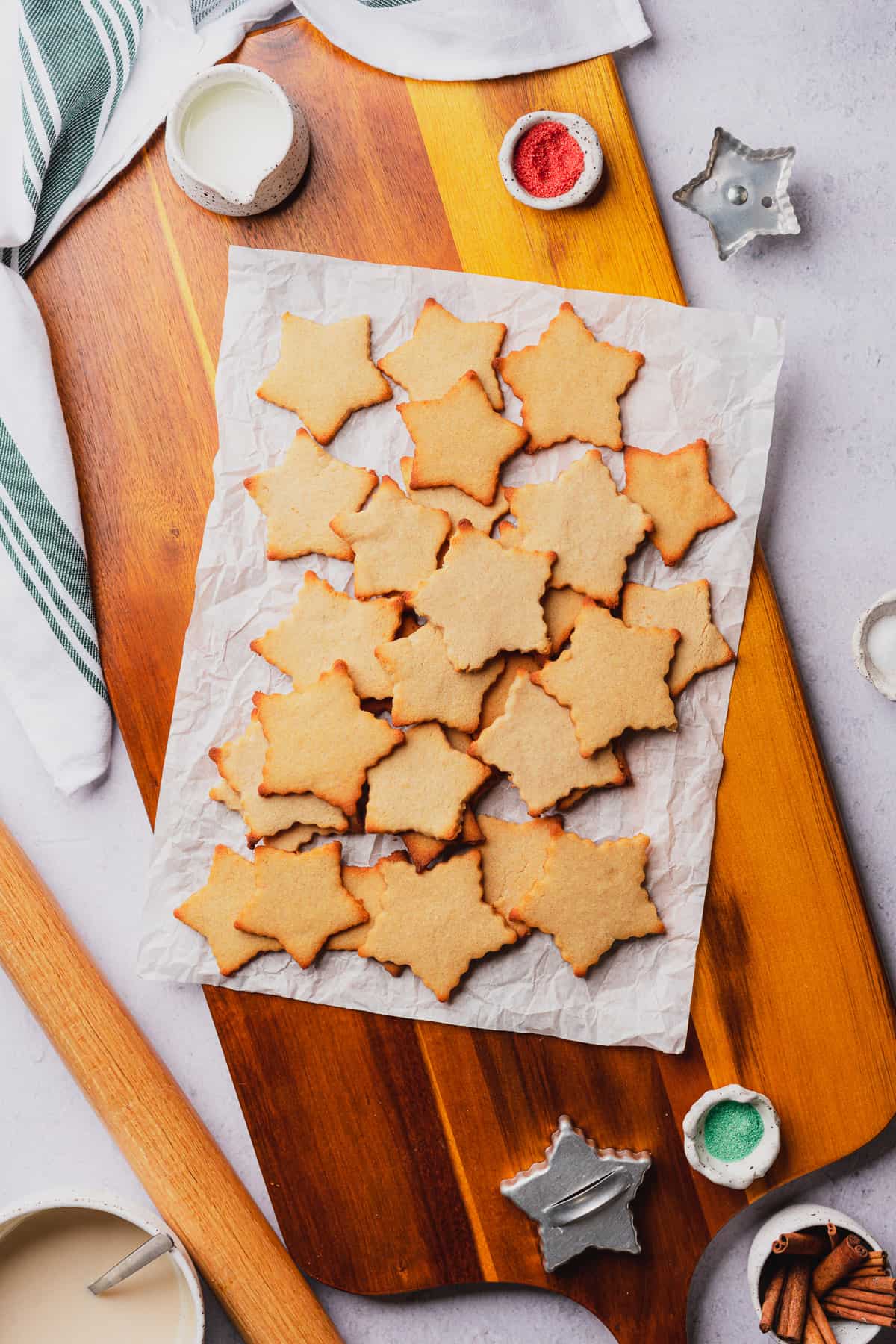 sugar cookie star cutouts on a piece of parchment paper