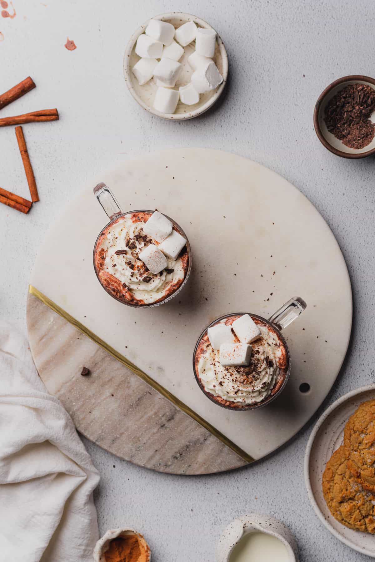 hot cocoa topped with whipped cream and marshmallows 