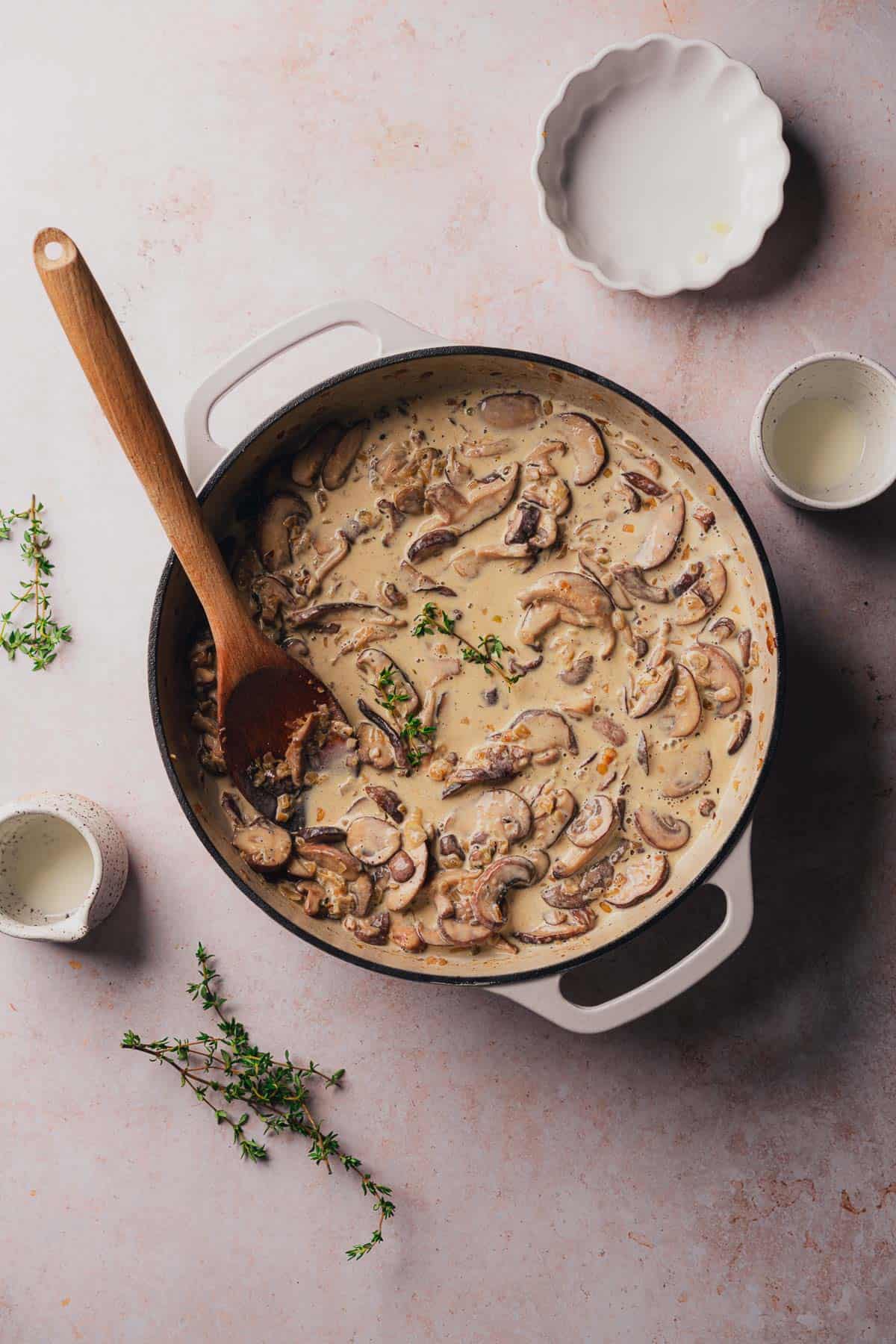 thickened keto mushroom sauce in an enameled cast iron