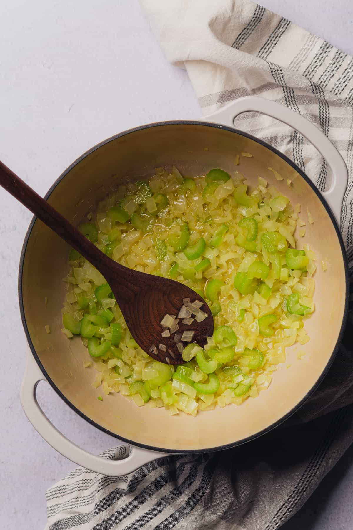 cooking celery, and onions in an enameled dutch oven with butter