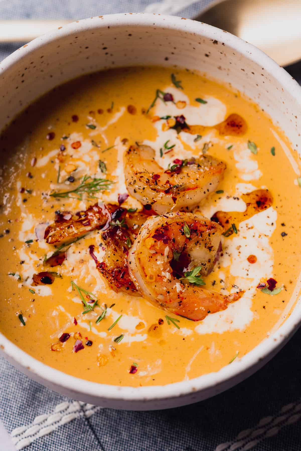 lovely bowl of spicy keto shrimp bisque with heavy cream, fresh dill, thyme, black pepper and red pepper flakes