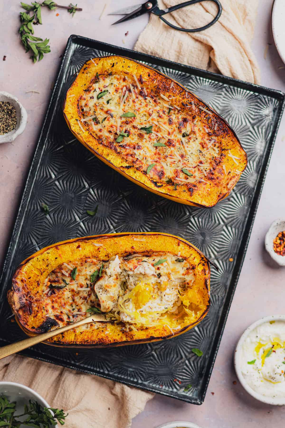 delicious cheesy baked spaghetti squash boats served with fresh herbs