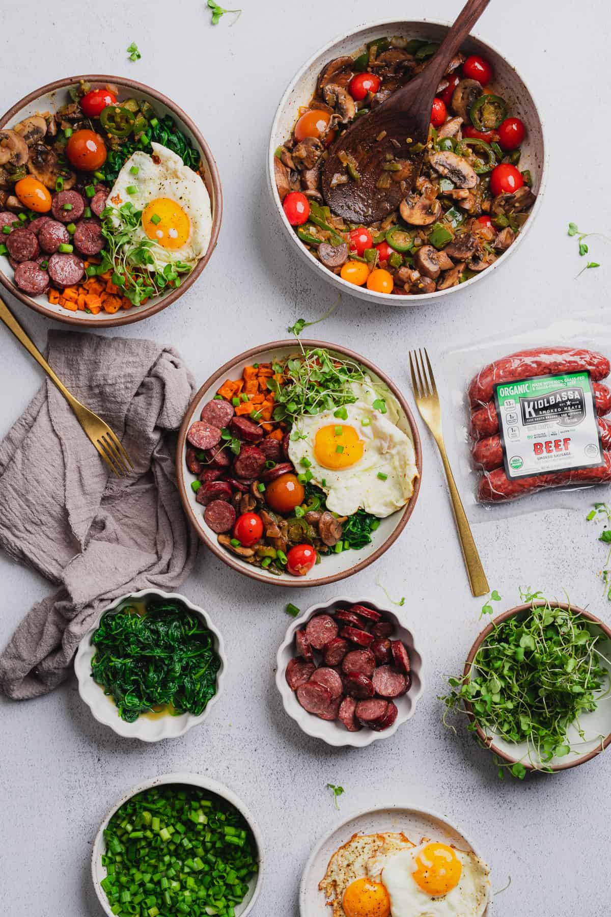 superfood energy bowl topped with eggs, veggies and kiolbassa smoked meats smoked sausage 