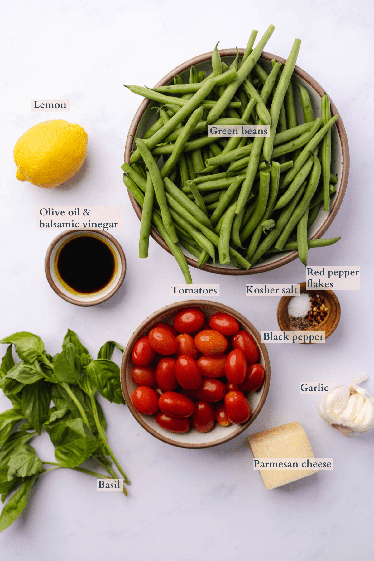 ingredients to make an Italian green bean salad with to denote different ingredients 