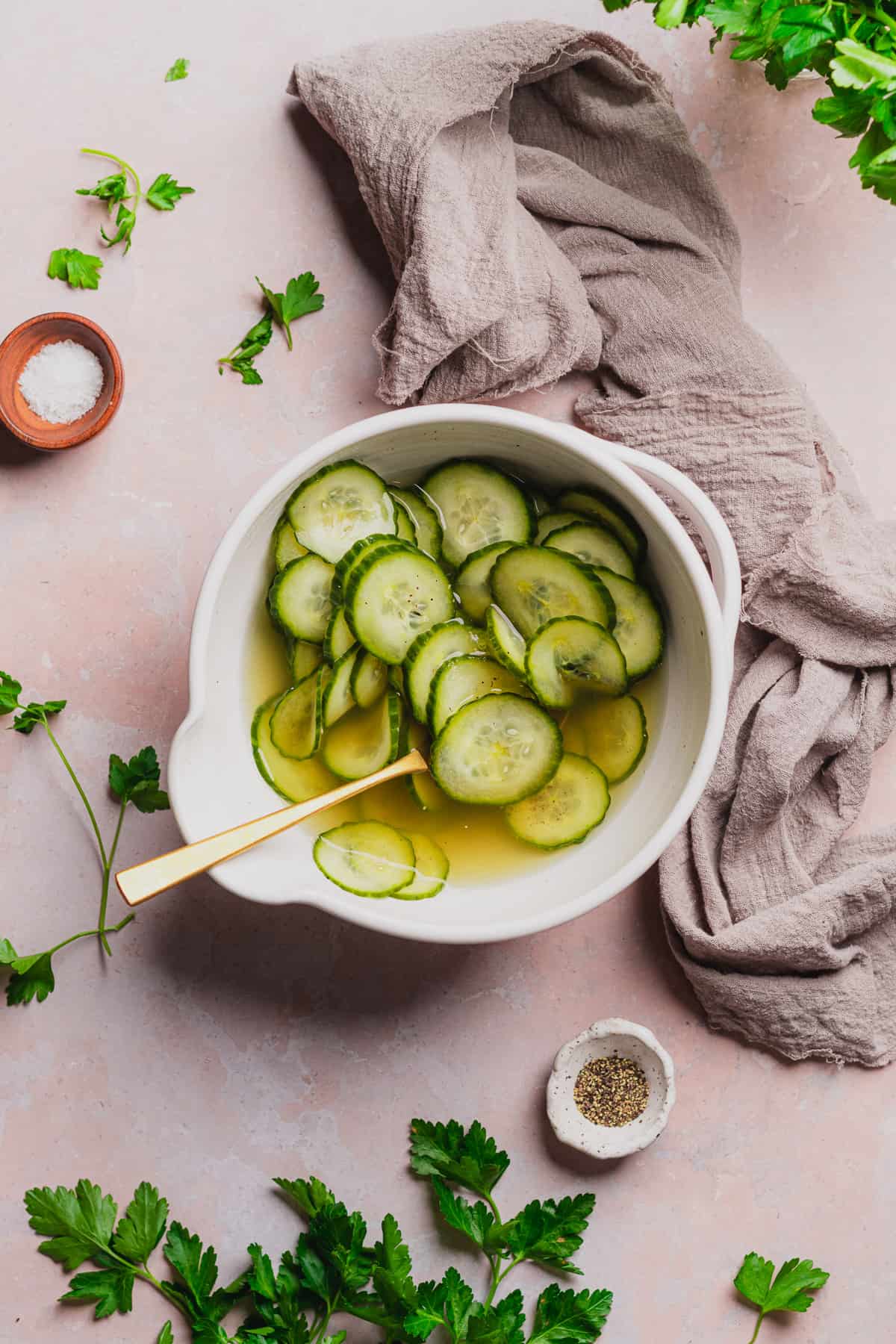 pickled cucumbers in a bowl of brine that are now pickled. 