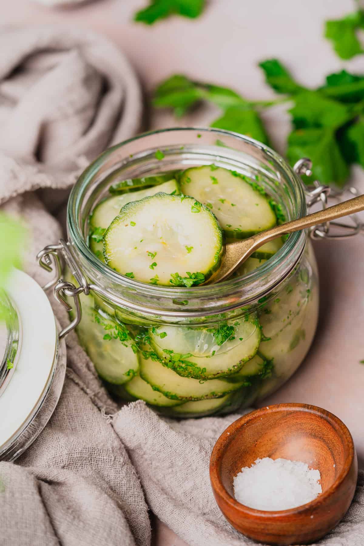 jar of agurksalat, norwegian cucumber salad with fresh parsley. 