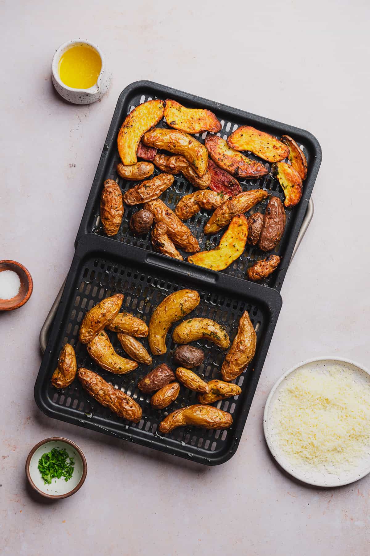 crispy fingerling potatoes on an air fryer tray