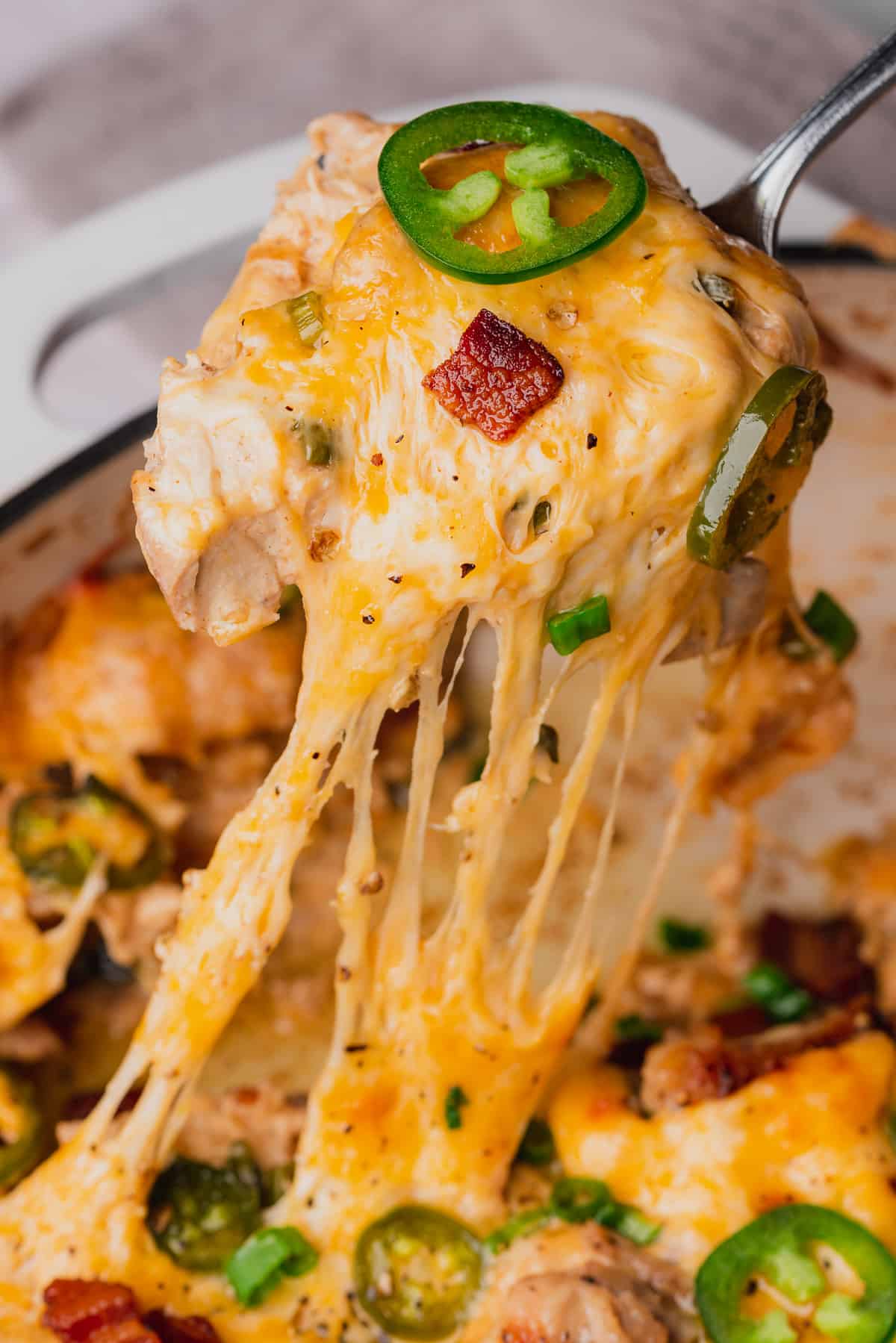 super cheesy jalapeno popper chicken skillet with a great cheese pull