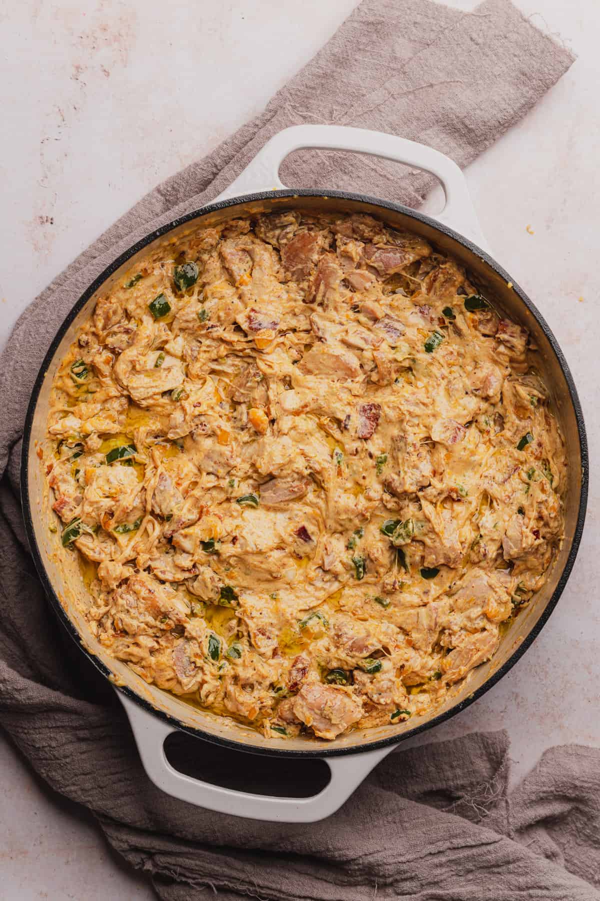 creamy chicken and jalapenos with bacon in a skillet