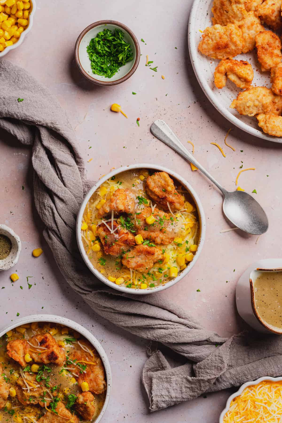 flat lay of a kfc famous bowl recipe with corn, cheese, mashed potatoes, cheese and gravy. 