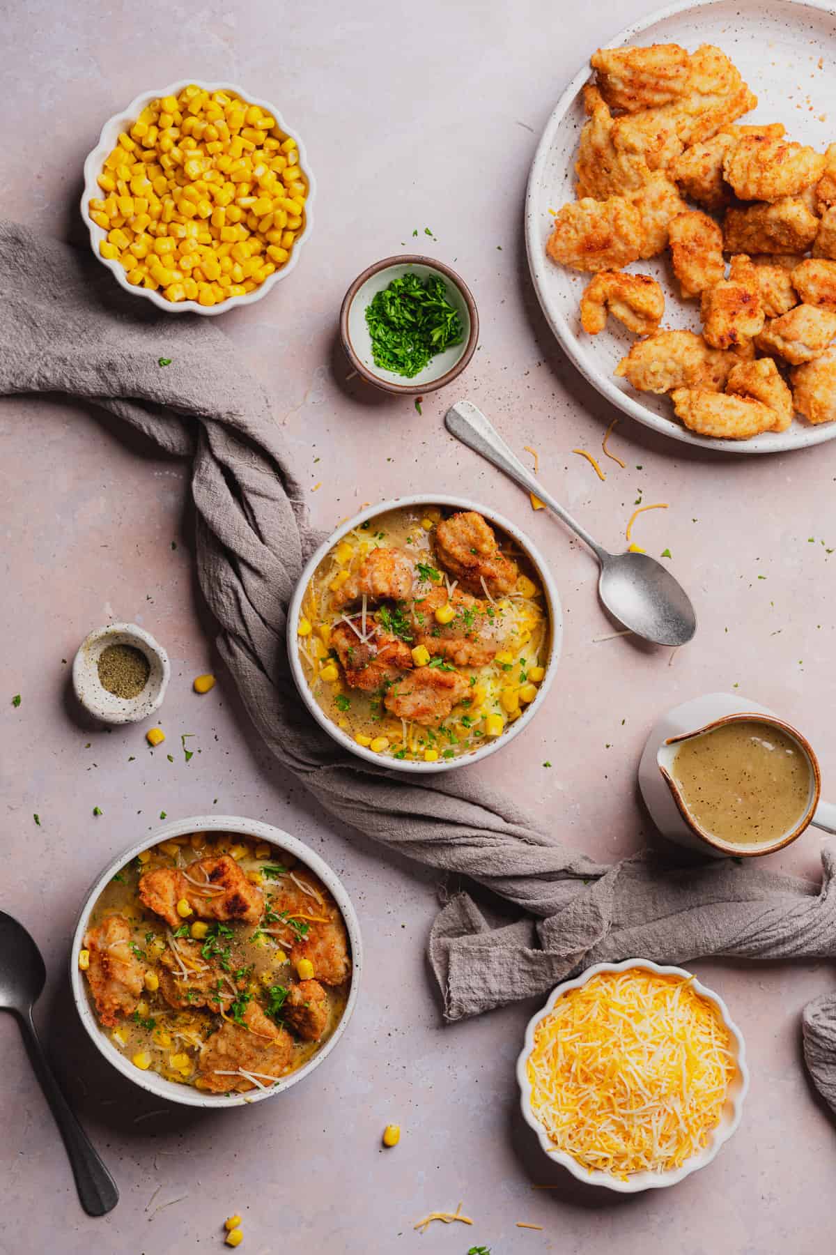 KFC famous bowls with gravy, cheese, parsley, corn and chicken nuggets in bowls. 