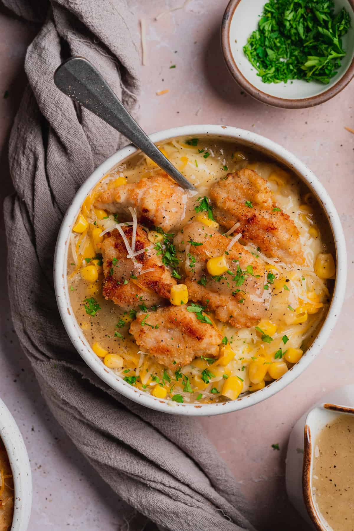 overhead shot of a kfc famous bowl with a spoon inside. 