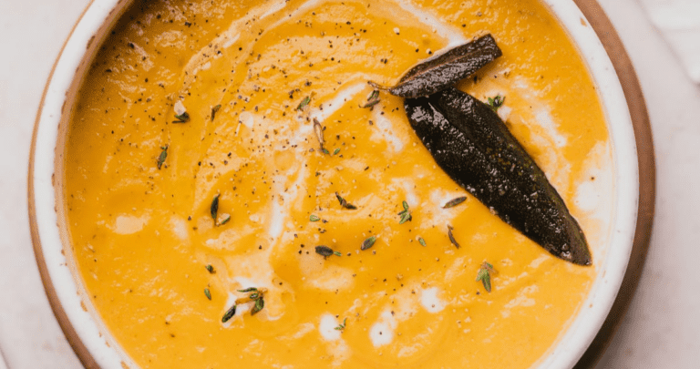 keto butternut squash soup with crispy fried sage drizzled with olive oil, fresh thyme, and heavy cream
