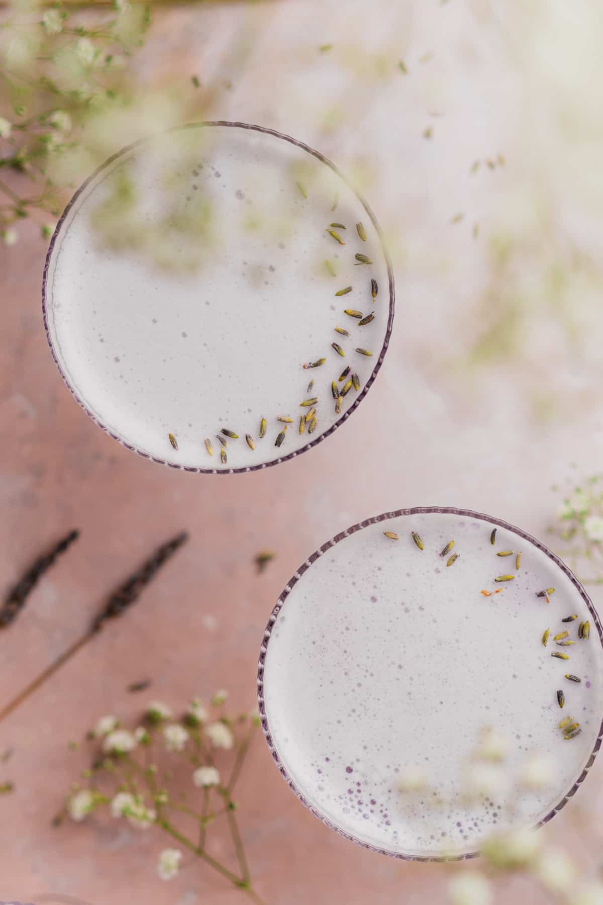 flat lay shot of two lavender gin cocktails from overhead
