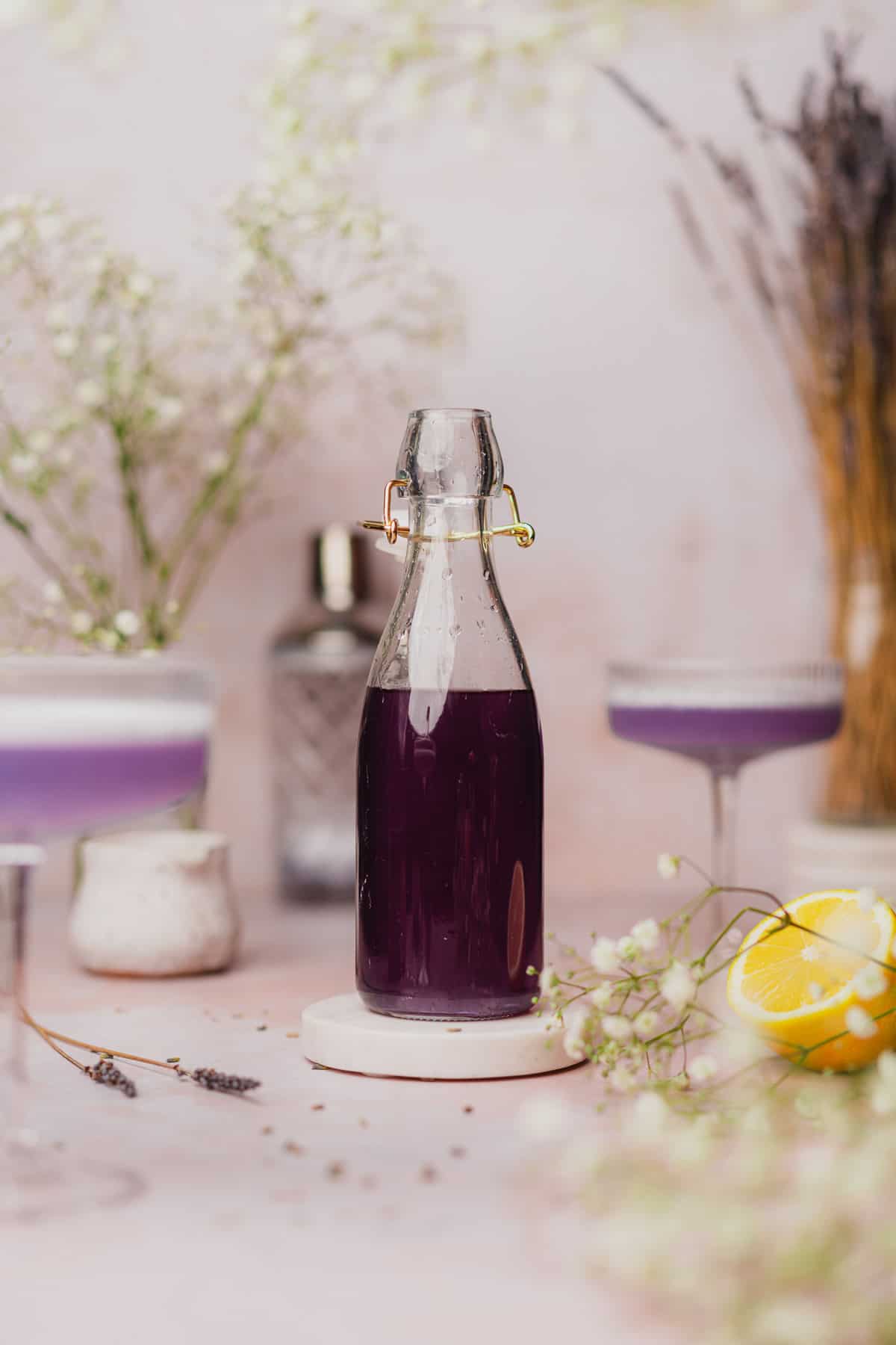 beautiful lavender simple syrup with lavender cocktails near by and baby's breath flowers 