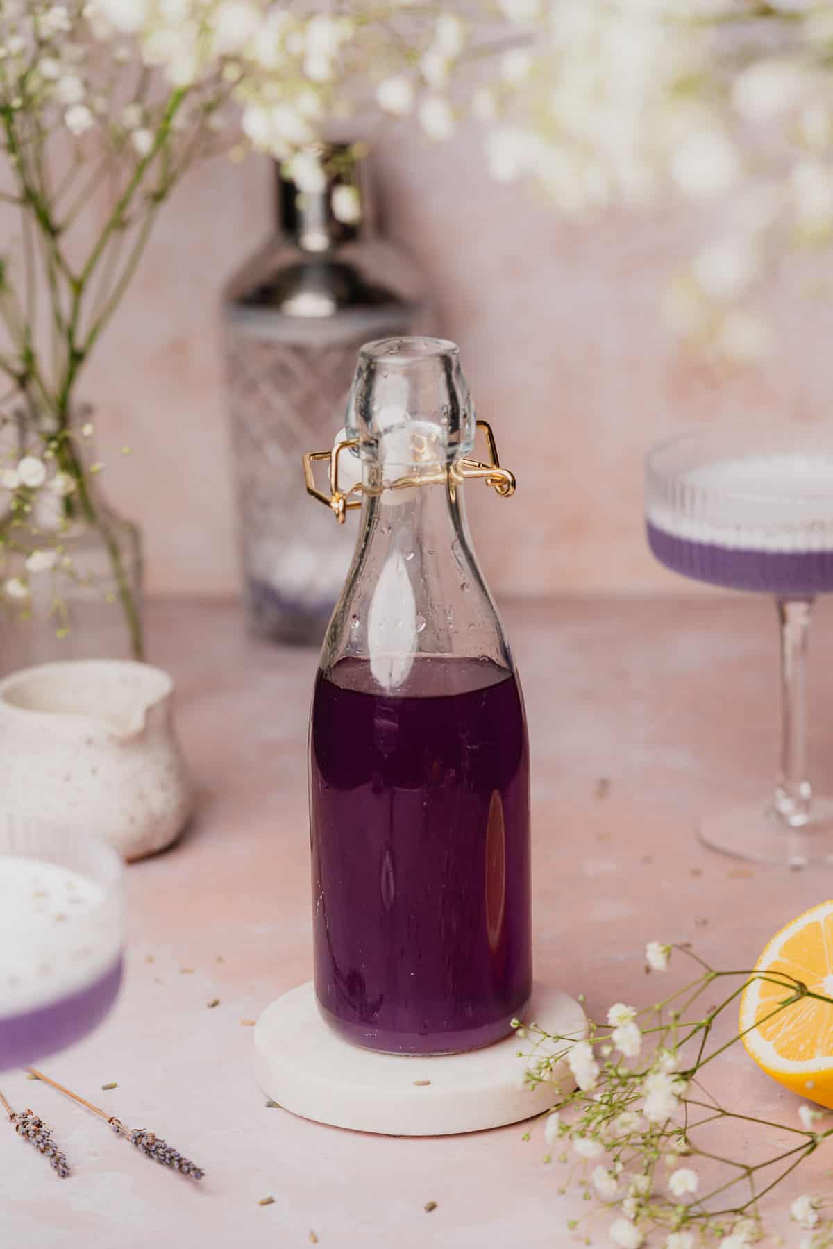 sugar free lavender simple syrup recipe with two couple glasses with lavender cocktails inside