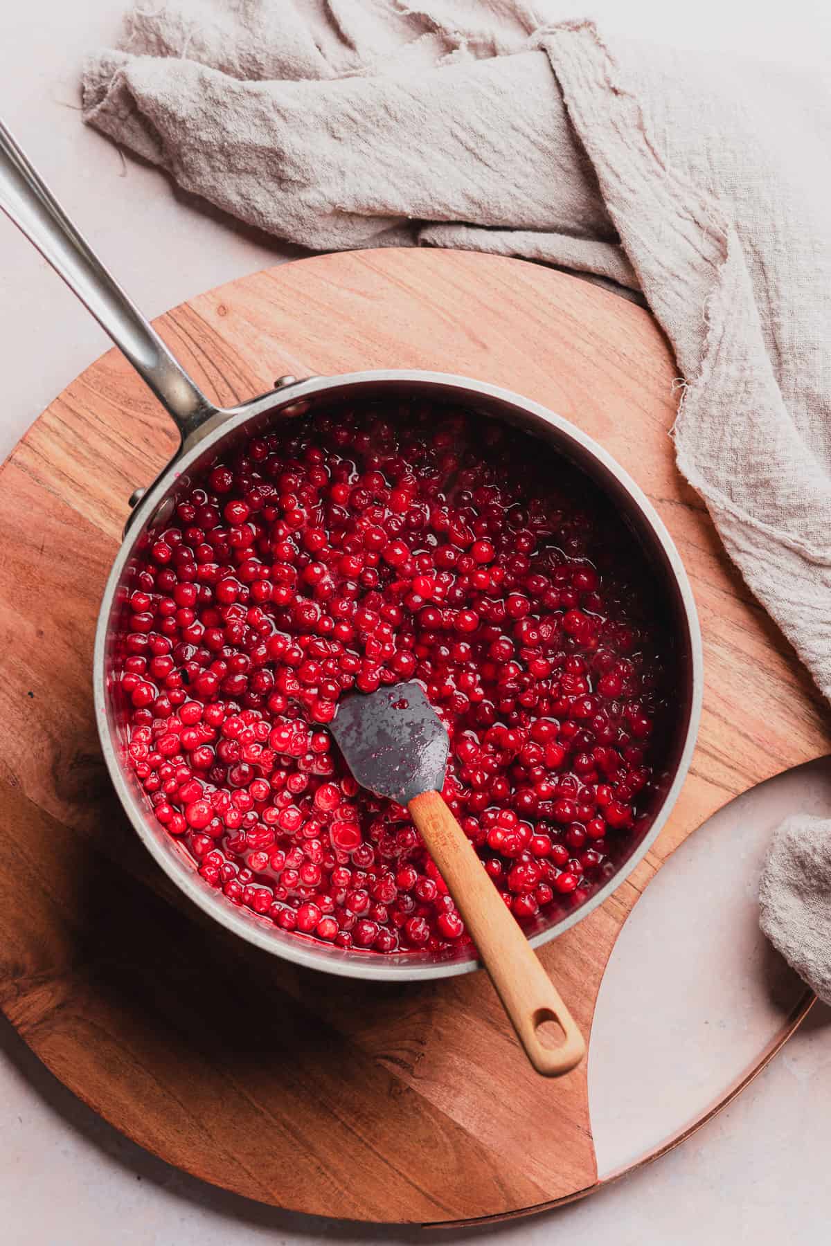 frozen lingonberries in a sauce pan slightly cooked down with water.