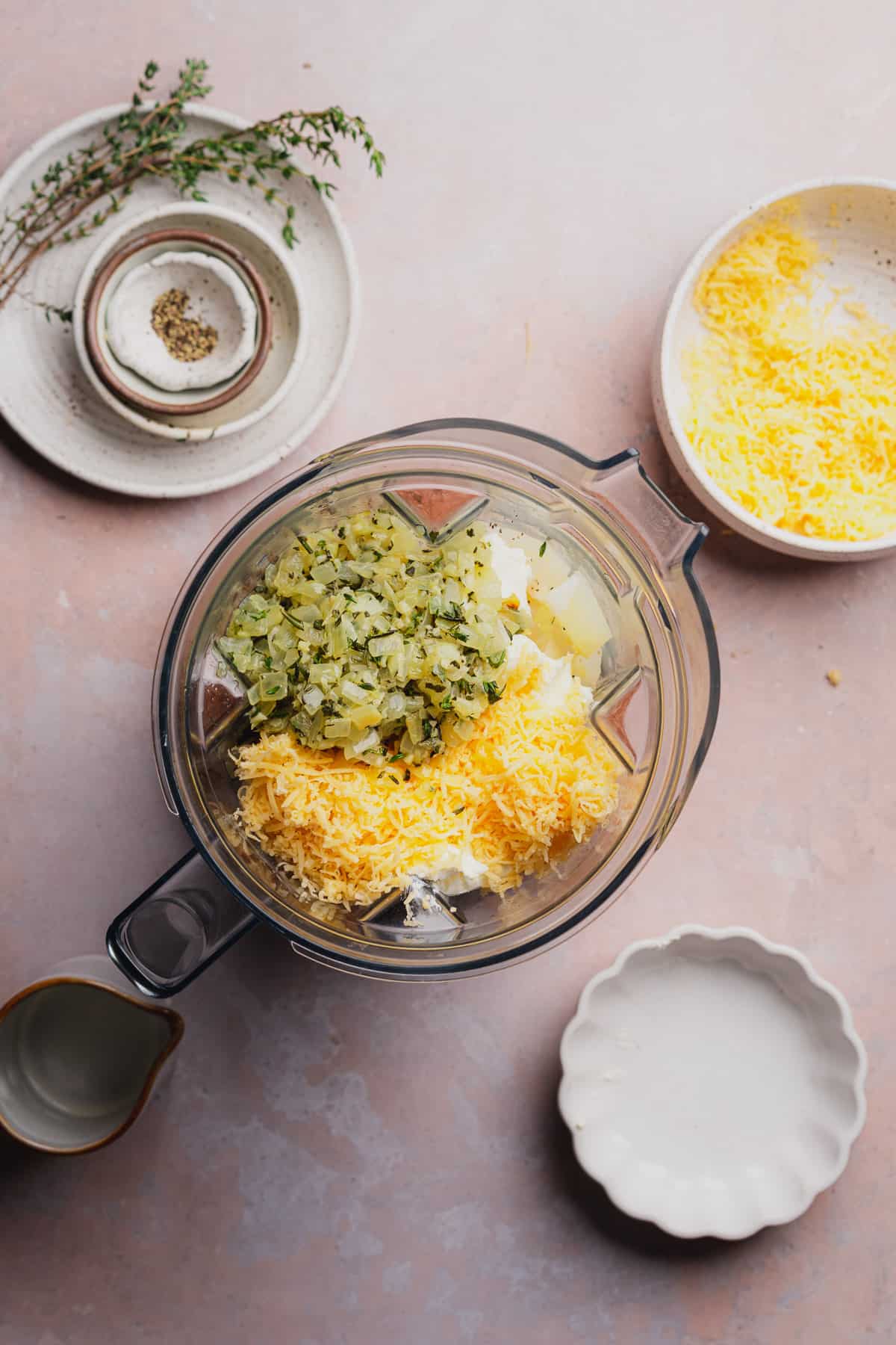 cooked onions, herbs, turnips, and shredded cheese in a blender.