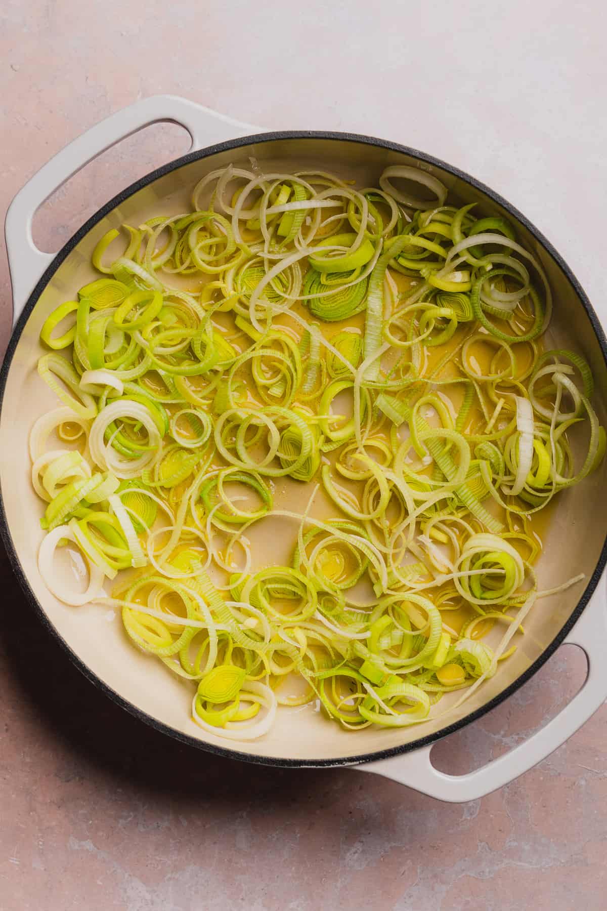 frying leeks in hot oil in an enameled cast iron skillet.