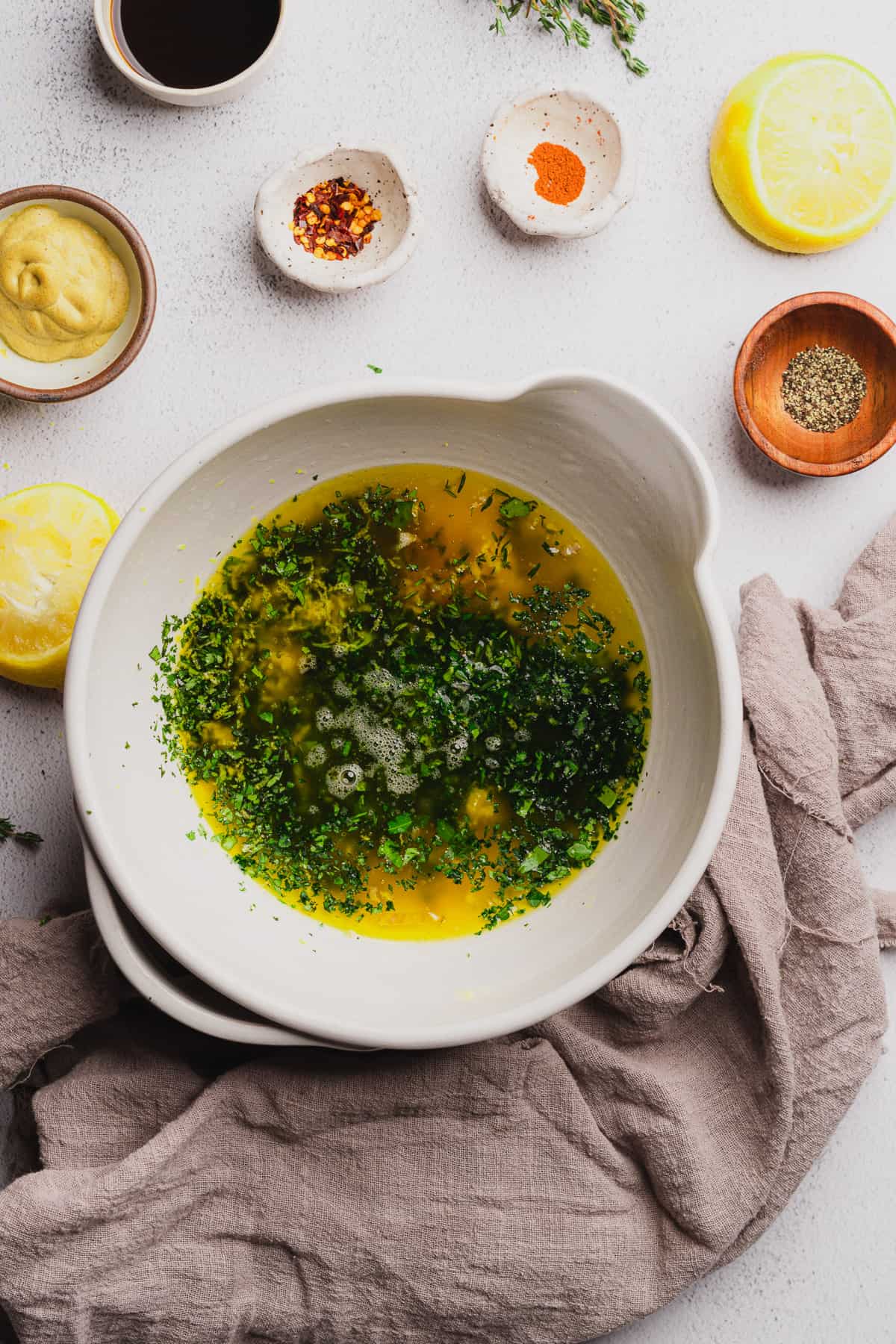 melted butter with chopped herbs, salt, pepper, lemon juice and zest in a mixing bowl. 