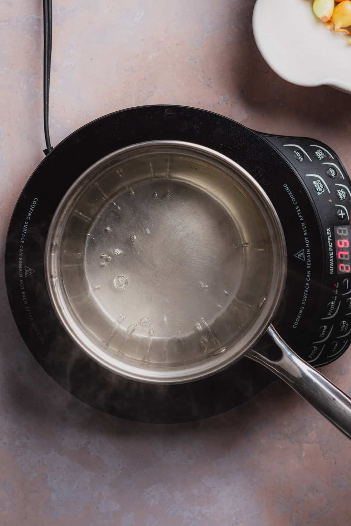 boiling water in a sauce pan 